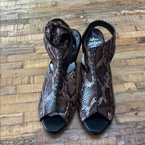 Gorgeous new python heel w Velcro backing. Originally $555